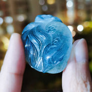 This nine tails fox carving is made from blue rabbit hair quartz crystal.
