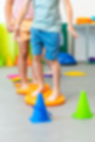 Kids group physio therapy. Children exercising during physical therapy session. Bilateral
