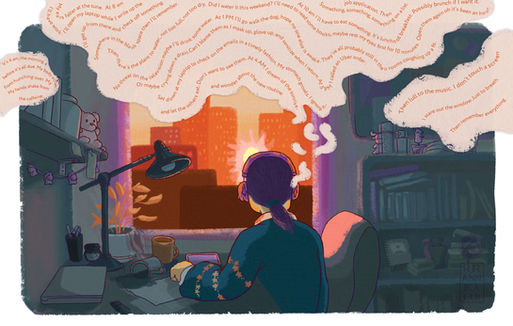 A woman sits at a desk staring at a sunrise out a window.