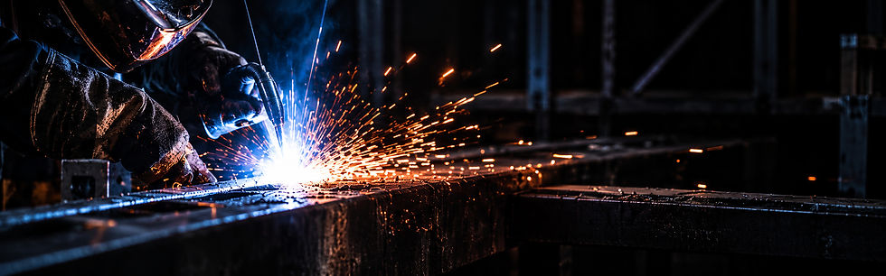 Industrial welder amid flying sparks_edited.jpg