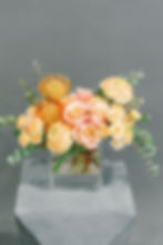 Mixture of yellow roses, pincushions and ranunculus arranged in a acrylic box by Lena's Floral Designs, handmade in Toronto.