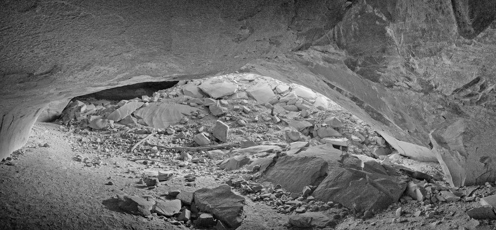 B&W photo of interior of Ballroom Cave in Butler Wash, Bears Ears National Monument.