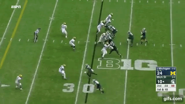 Jourdan Lewis intercepts a pass against the Spartans.