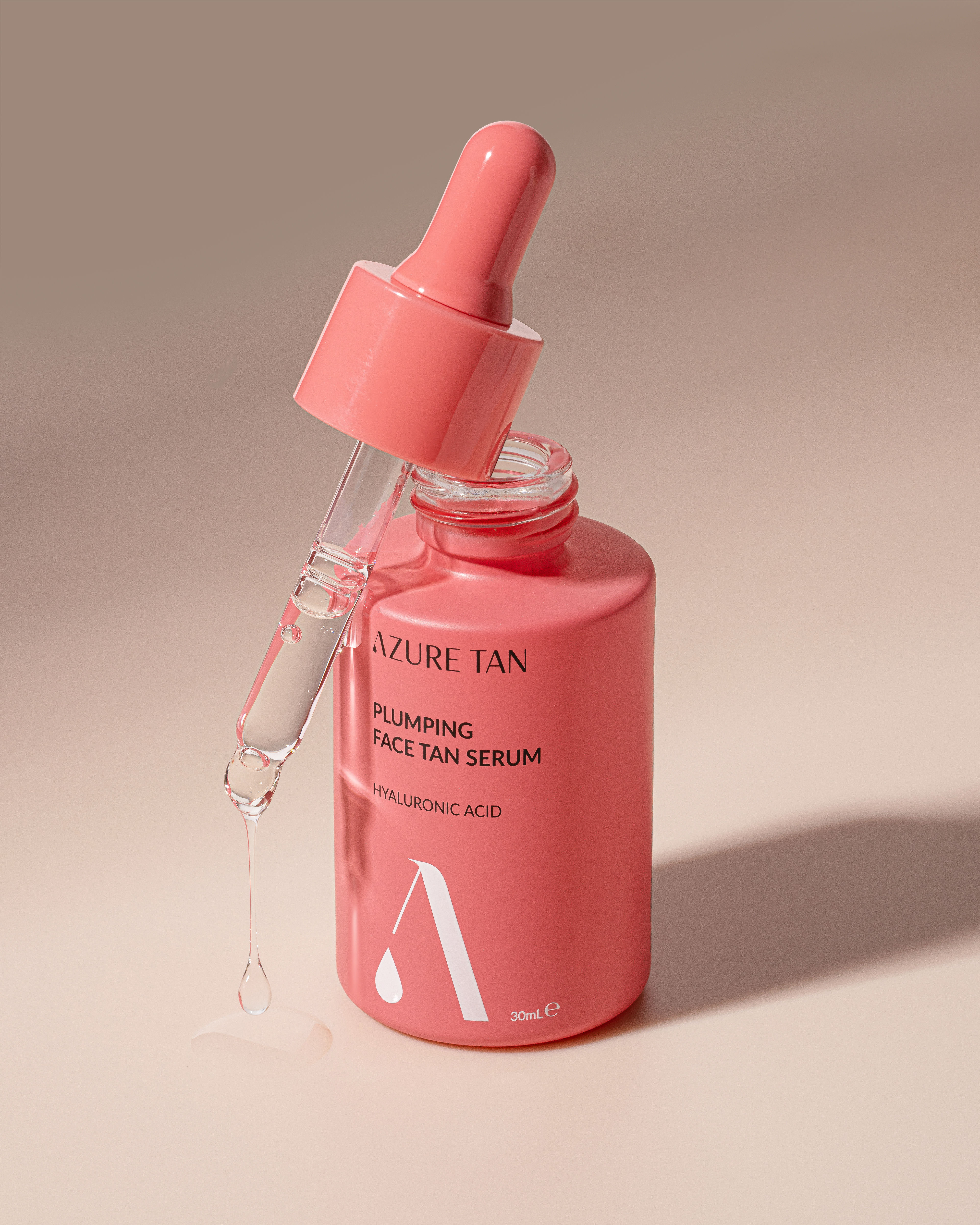 Azure Face Plumping Tan Serum with dropper showing serum