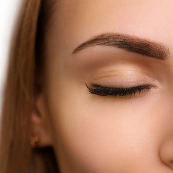 lady with manicured lashes and brow