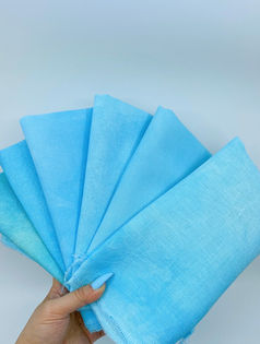 A hand dyed cross stitch fabric "Rockin Robin" featuring a robin blue color.