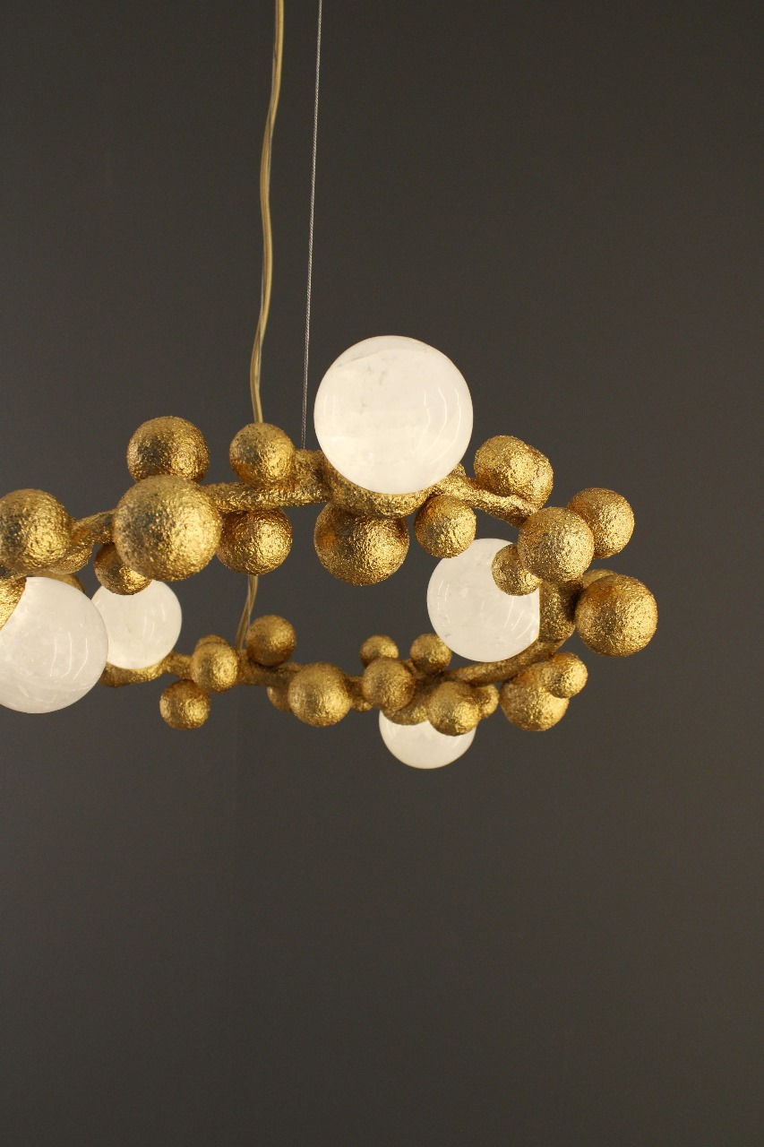Thumbnail: Close-up of Bubbles Pendant light fixture showing white quartz spheres and smooth ceramic patterns.