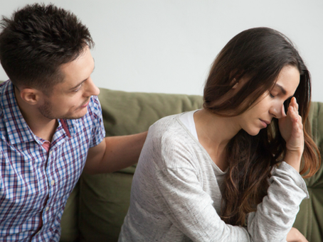 Caring husband apologizing crying upset wife excusing for being wrong