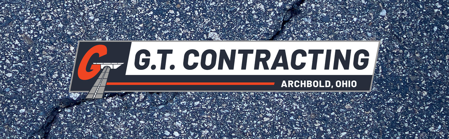 G.T. Contracting Archbold Ohio logo on asphalt road surface. GT Contracting