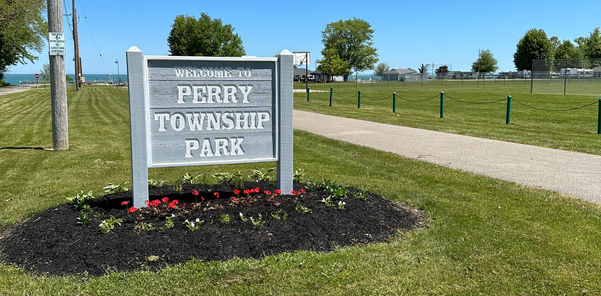 Perry Township Park sign on a sunny day. PARK with a walkway. Perry TWP - LC