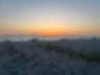 Sunset over beach with people