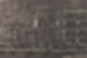 Antique tools displayed on wooden shelves and walls