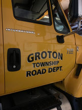 Yellow International truck with GROTON TOWNSHIP ROAD DEPT. Groton TWP.