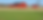 Two red barns on a farm field