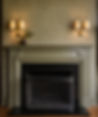 Luxury Custom Fireplace Renovation by Peluso Construction Featuring Detailed Millwork, Textured Wall Finishes, Designer Brass Sconces, and High-End Modern Traditional Interiors in Rockland County NY.