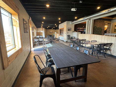 The combination of raw wood, metal, exposed brick and rich browns create a rustic, yet elevated feel