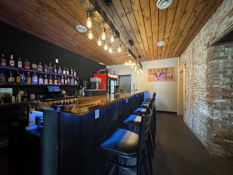 Warm lighting creates an inviting Speakeasy baratmosphere