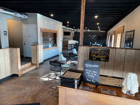 Enjoy the well-lit dining room and spacious seating areas with easy access to the tap wall