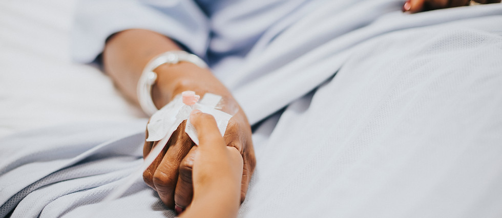 daughter-holding-her-mothers-hand-hospital.jpg