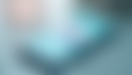 Smartphone on a table displaying a meditation app with a woman in a yoga pose. Soft lighting and blurred background create a calm mood.