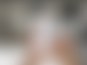 Hands hold a phone showing a video call with an AI therapist.