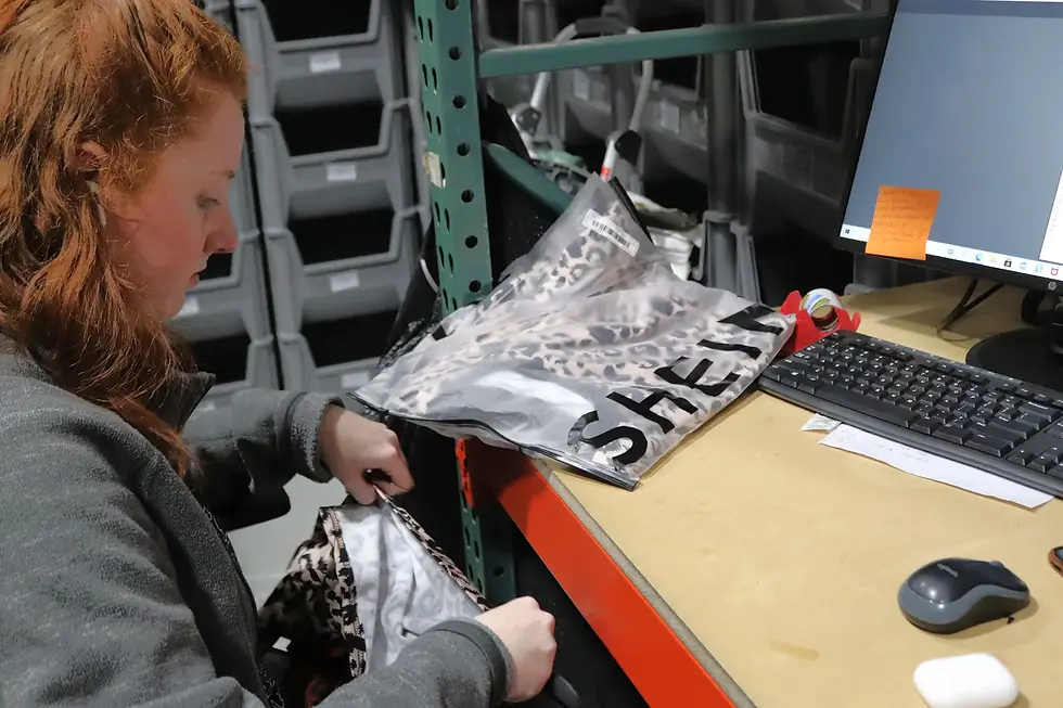 Small business owner managing online orders at Room2Work, Roswell GA