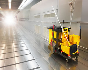 Cleaning tools cart park between walkway building..jpg