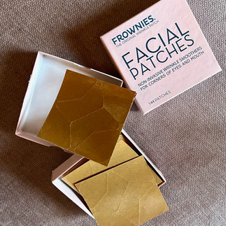 Frownies Facial Patches in a pink box, opened on a counter