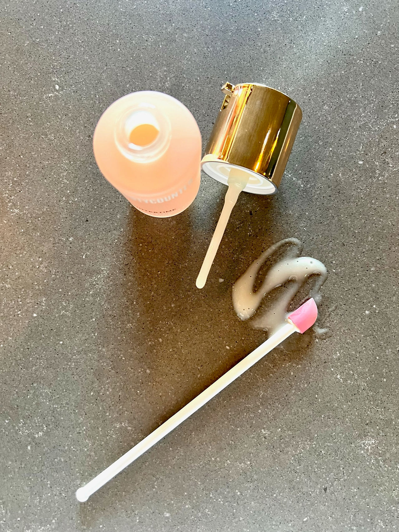 Spatty Tool with Product Laid Out Next to It