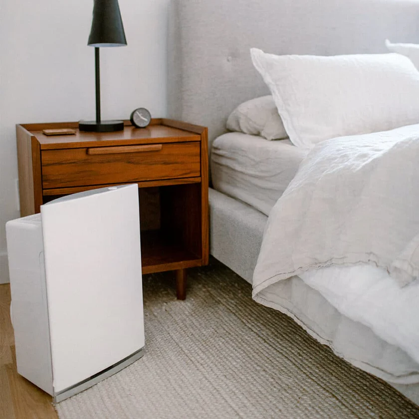 Intellipure Air Filter Next To A Bed