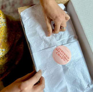 Opening a Vibrant Body Package. It's in a cardboard box with tissue paper