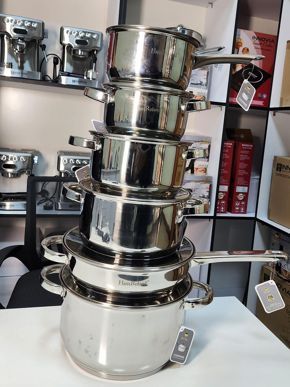 Thumbnail: Stacked stainless steel pots display in kitchenware store, Leks Kitchenware.