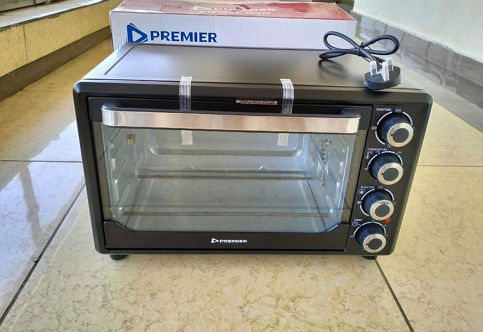 Black Premier oven with knobs, glass door, and a Premier box in background.