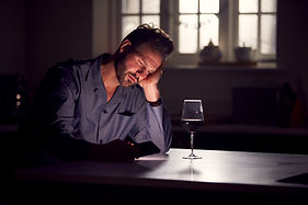 unhappy-man-wearing-pyjamas-sitting-in-kitchen-wit-2024-10-20-09-19-14-utc.jpg