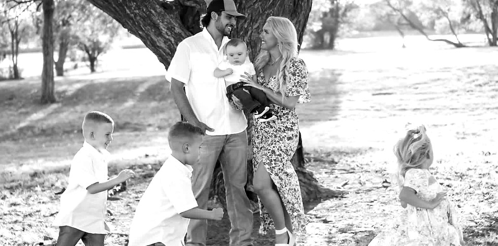 Family outdoors, securing better insurance rates for their future.