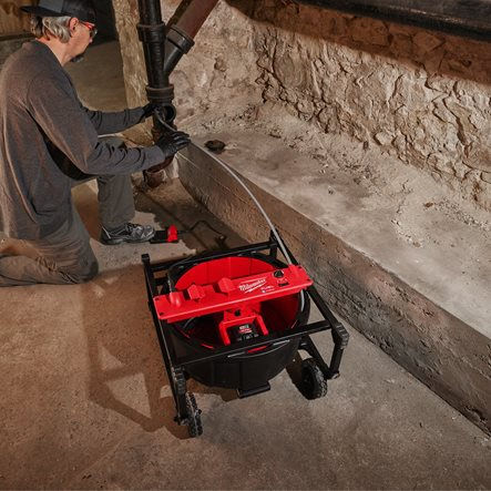 Thumbnail: A man using a Milwaukee M18 High Speed Flexible Shaft Machine to clear the blockage out of a pipe in a commercial setting.