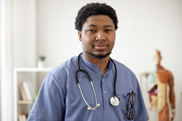 surgeon-scrubs-with-stethoscope-standing-office_161094-13421.jpg