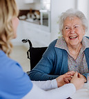 nurse-giving-medicine-to-senior-woman-at-her-home