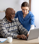 young-woman-nurse-helping-black-senior-man