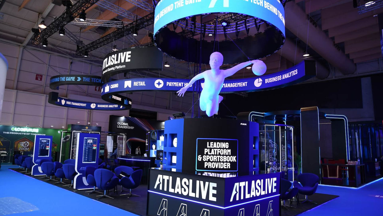 ATLASLIVE booth display with prominent text, advertising leading platform & sportsbook provider.