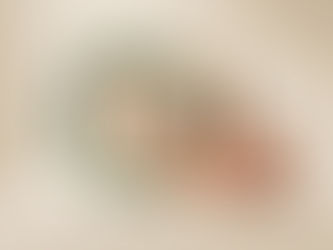 three rings in gold, green, terracotta connecting 