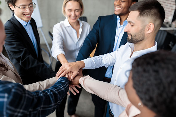 coworkers-holding-hands-during-corporate