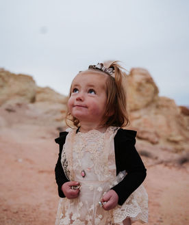 Young girl in western attire at The Ranch at Wild Rose, highlighting the family heritage and luxury ranch lifestyle in Alton, Utah.