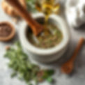 High-quality image of herbal preparation (mortar & pestle, raw herbs, pouring oil, etc.jpg