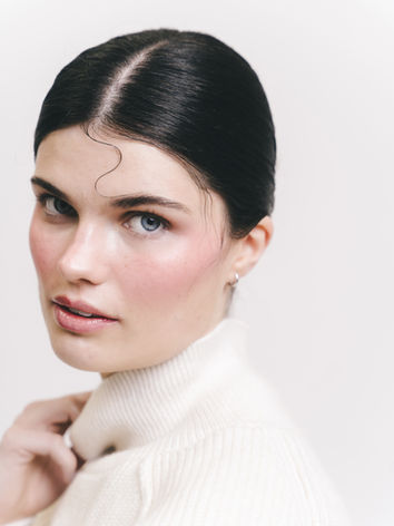 Fashion editorial beauty featuring radiant skin, sculpted cheeks and natural flush.