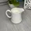 Thumbnail: vintage white Noritake porcelain creamer filled with clean scented soy candle