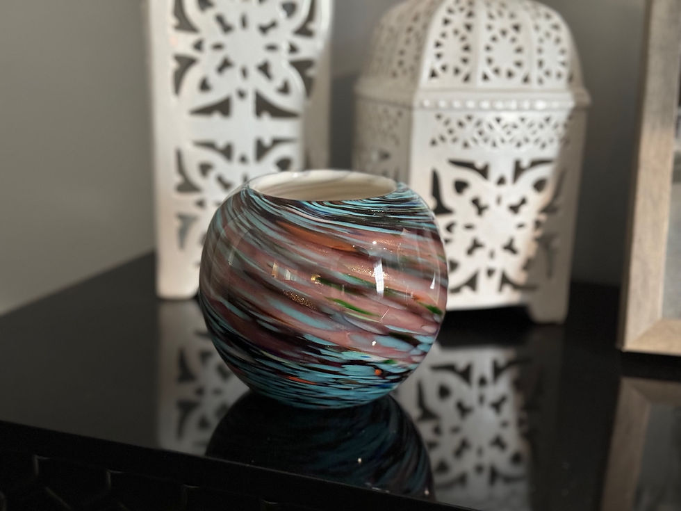 Art glass bowl with metallic details filled with all natural highly scented soy candle by Decor and Wicks candle shop. 