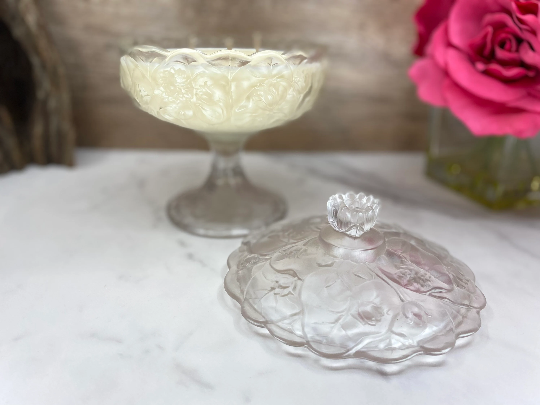 Thumbnail: Vintage Fenton water lily glass pedestal candy dish filled with all natural highly scented soy candle by Decor and Wicks candle shop. 