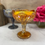 Thumbnail: Vintage Imperial glass marigold carnival pedestal dish filled with hand poured highly scented soy candle by Decor and Wicks candle shop. 