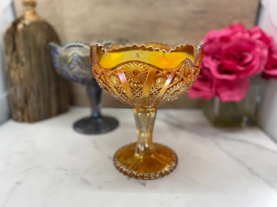 Vintage Imperial glass marigold carnival pedestal dish filled with hand poured highly scented soy candle by Decor and Wicks candle shop. 